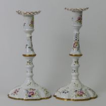 A pair of 18th century Bilston enamel candlesticks. 24 cm.