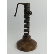 19th Century iron and wood spiral courting candle holder on a later base, 22cm.