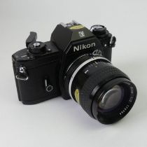A Nikon EM camera and lens.