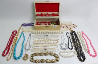 A jewellery box and contents including silver pendants and earrings.