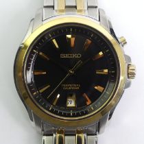 Seiko stainless two tone watch with a black dial and perpetual calendar. 43 mm in diameter.