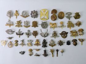 47 various military cap badges, including The Royal Warwickshire Berkshire and Brenockshire