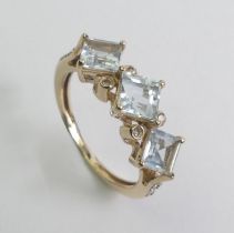 9ct gold aquamarine and diamond ring, 2.8 grams. Size N 1/2 7.8 mm wide.