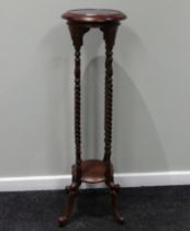 A mahogany jardiniere stand on barley twist supports. 99 cm high.