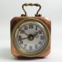 German copper and brass travel alarm clock of cube form, marked DRP & GM. 4.5 cm.