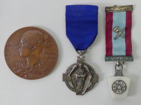 A Masonic jewel 1914-18 one other and a Victoria 1897 jubilee medallion.