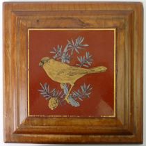 A framed Victorian pottery tile depicting a Bullfinch. 25.5 cm square.