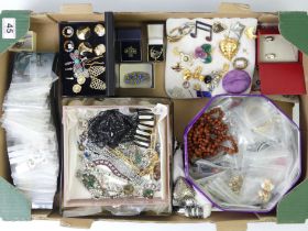 A box of costume jewellery including crystal bracelets.