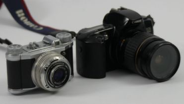 A Canon EOS 500 camera and an Altix Vebur camera.