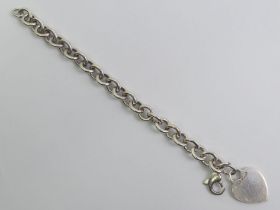 Tiffany & Co silver heart tag bracelet, 35.8 grams, London assay mark, 18.5cm.