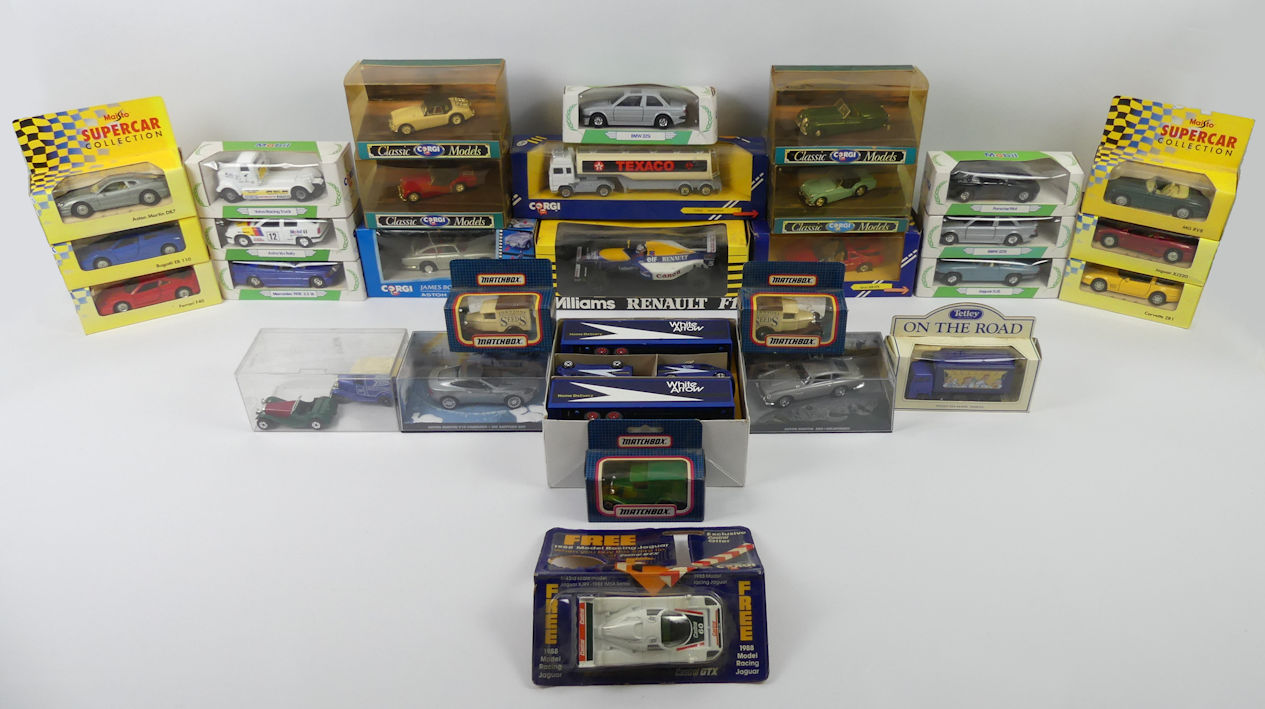 A box of boxed diecast cars including Corgi James Bond Aston Martin DB5, Corgi classic models.