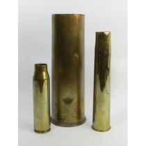 World War I shell case and two others, largest 29.5cm.