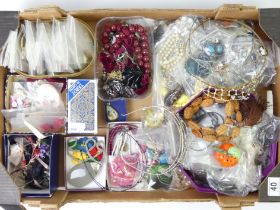 A box of assorted costume jewellery including tiaras.