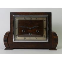 A 1930's oak Westminster chime mantle clock with key and pendulum. 32 x 23 x 12 cm.