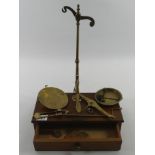 A mahogany cased set of shop scales with Hunt & Co label, 31.5cm wide.
