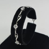 9ct white gold CZ and diamond bracelet 5.4 grams, 18.5cm x 5.6mm.