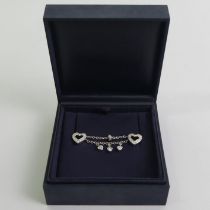 14ct white gold diamond set linked collar studs, 6.3 grams excluding sprung backs, 55mm x 10mm.