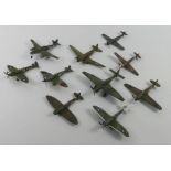 Ten unboxed diecast warplanes.