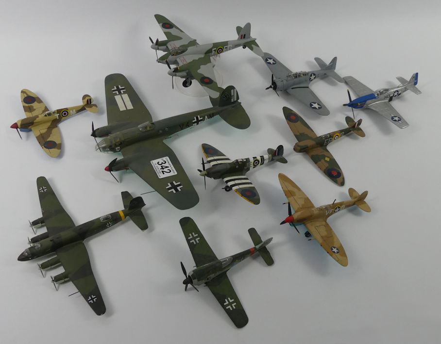 Ten unboxed diecast warplanes.