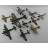 Ten unboxed diecast warplanes.