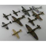 Ten unboxed diecast warplanes.