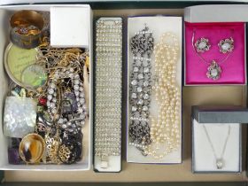 A tray of mixed costume jewellery including stone set bracelets.