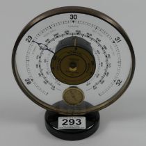 A Jaeger table top barometer and thermometer. 18cm high. Condition report: In working order.