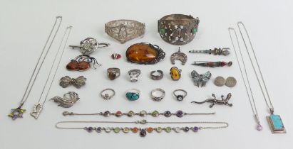 A mixed lot of mostly silver jewellery including a large amber pendant.