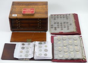 A 19th century coin collectors cabinet and three folders of GB coins along with a tin of old