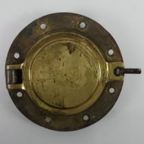 A brass ships port hole, 26cm.