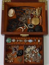 A leather jewellery box and contents including silver rings.