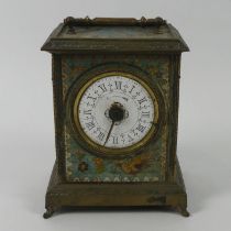 Ornately decorated brass mantle clock from the 19th century, 19.5cm to top of handle.