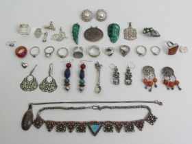 An interesting collection of silver and stone jewellery including rings, brooches and pendants.