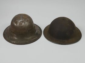 A British MKII Royal Artillery Decal helmet and a British WWII Zuckerman helmet.