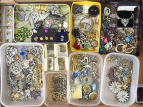 A box of costume jewellery including watch chains.