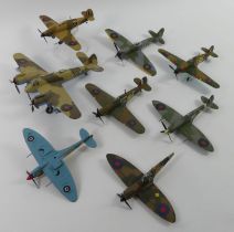 Eight unboxed diecast warplanes.