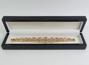 18ct gold graduated morganite and diamond set bracelet, 65.7 grams, 19.5cm x 21.3mm at widest point,