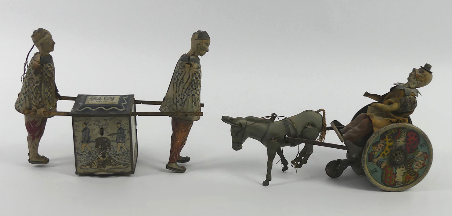 An early 20th Century DRGM clockwork tin plate horse and trap with clown driving together with a tin