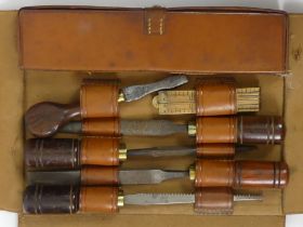 A vintage leather folding tool kit, 9cm x 22cm.