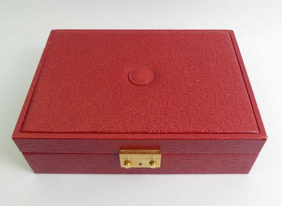 Rolex red leather jewellery and watch box with key, 29.5cm x 21cm x 9cm.