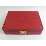 Rolex red leather jewellery and watch box with key, 29.5cm x 21cm x 9cm.