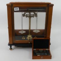 A cased set of chemistry scales by Stanton, London together with a cased set of weights.