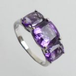 9ct white gold amethyst three stone ring, 2.9 grams. Size O 8.1 mm wide.