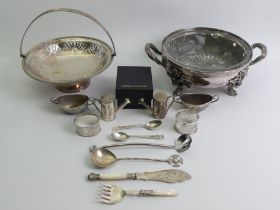 A collection of silver and plated items, including an ornate silver plated bowl and liner, bowl 30cm