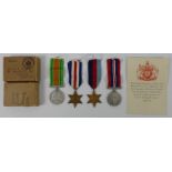WWII medals awarded to Mr. D. A. Seggar in original box with paperwork, containing 1939-45 Star,