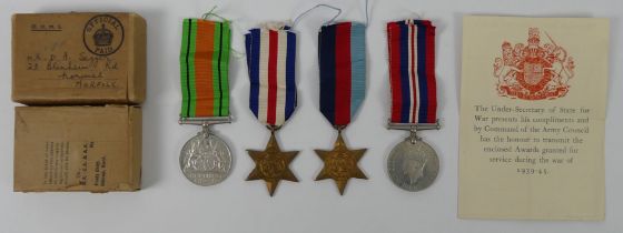 WWII medals awarded to Mr. D. A. Seggar in original box with paperwork, containing 1939-45 Star,