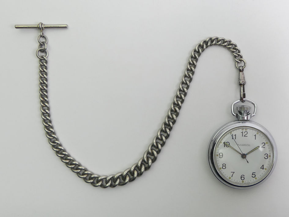 Ingersoll pocket watch and graduated kerb link Albert Chain, watch 50mm x 66mm. Condition Report: In