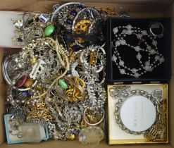 A box of mixed jewellery including silver items.