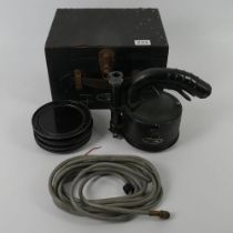 A boxed WWII Canadian RCAF morse code search light with six coloured lens marked AM ref 5A/152.