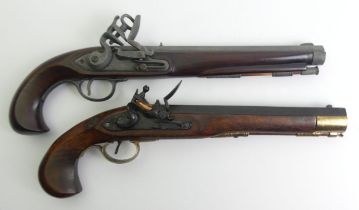 Two reproduction flintlock pistols, 39 cm long.